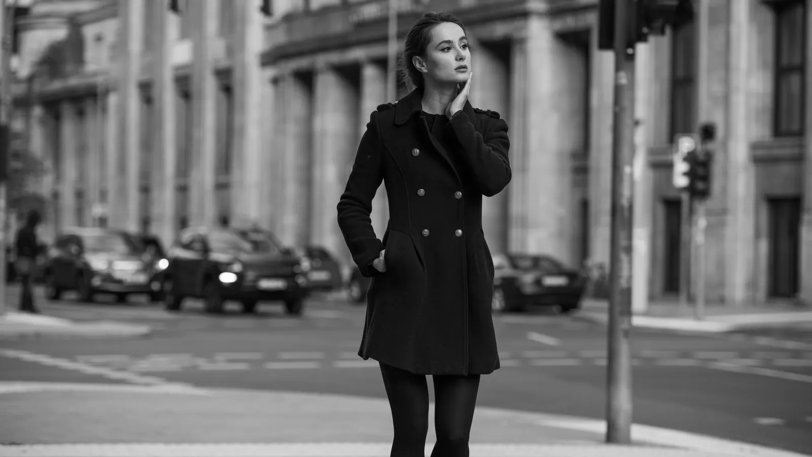 Woman on street in black coat
