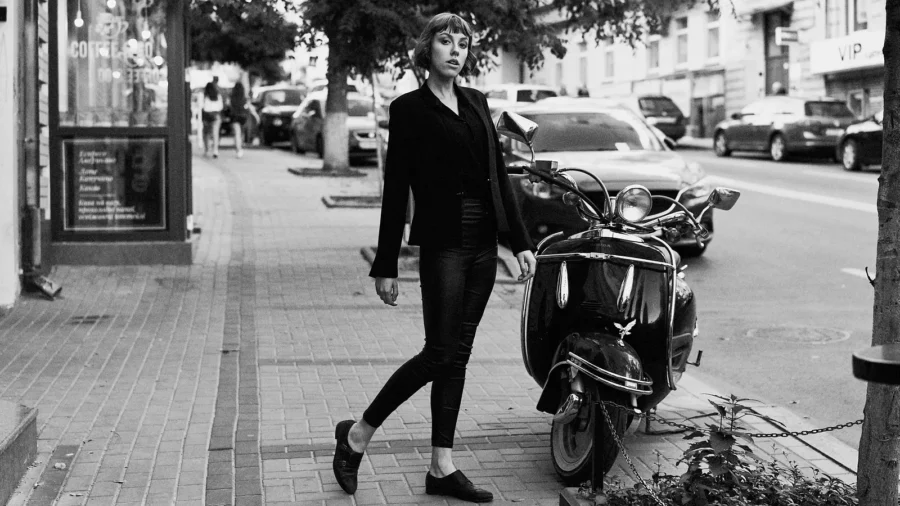 Young short haired woman in stylish black clothes